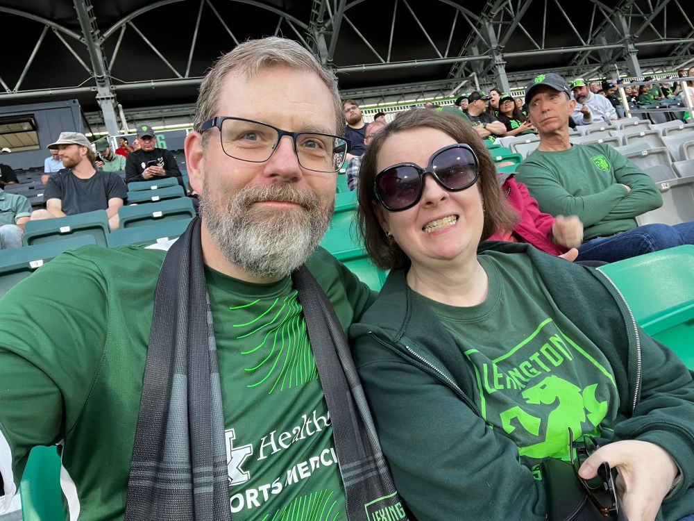 A couple enjoying a spring soccer game