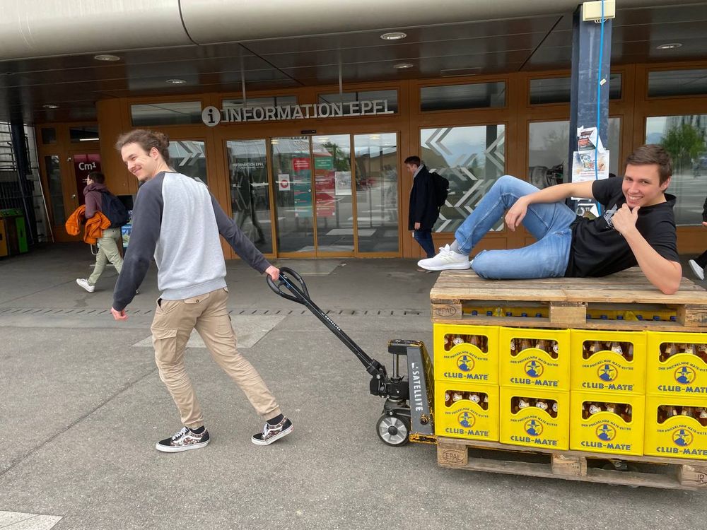 Polygl0ts committee members transporting 300 bottles of Club Mate across campus