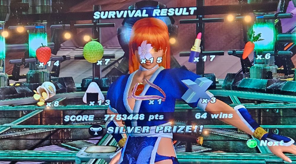 Yes this is a literal photo of my TV playing Dead or Alive 2 Ultimate on my Xbox 360. No, I can't take a screenshot because technology wasn't there at the time. Look at my crunchy photo with my silly Kasumi 64 Win Survival Mode accomplishment that only child me would go apeshit at. I finally got that godforsaken medal. 