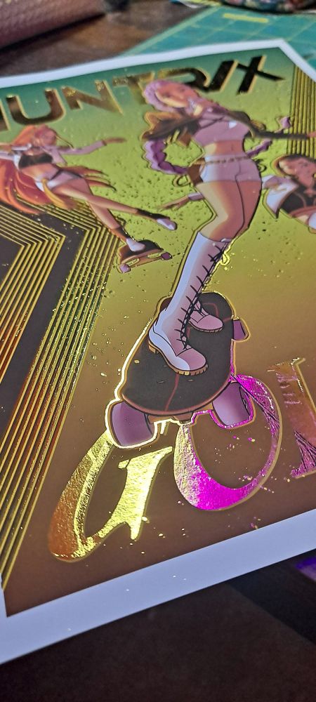 Gold foiled art of HUNTRIX (Rumi, Zoey, and Mira) from Kpop Demon Hunters, skating and drinking boba!