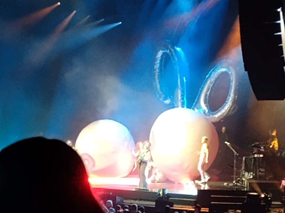 Giant inflatable boobs on stage.