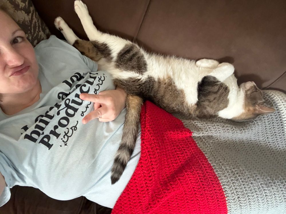 My weird ass cat laying on me upside down