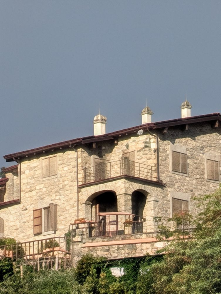 A zoomed in photo of a stone house 