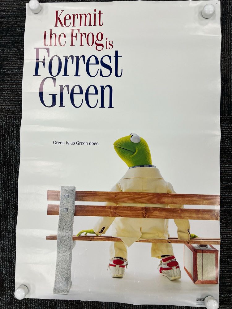 A movie poster of “forest Gump” but instead it’s “forest green” and has a picture of Kermit the frog in a tan suit sitting on a park bench