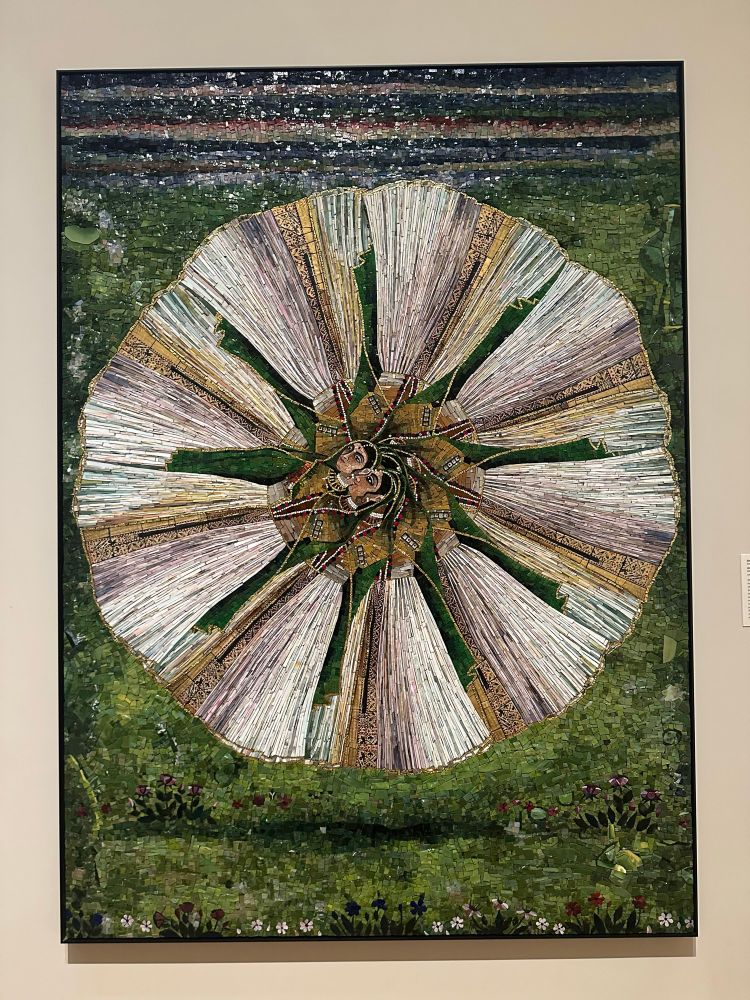 a heavily embroidered textile work  