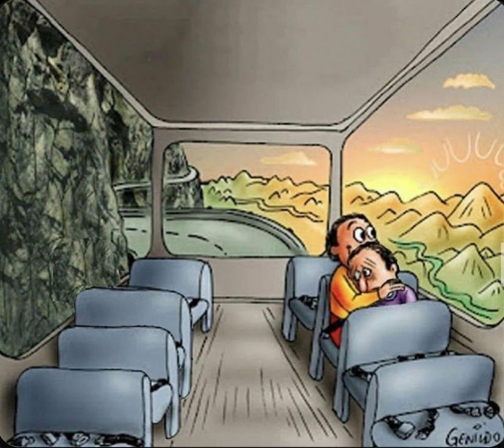 Two individuals embracing each other. One is smiling and looking out the window at the sunny scenery. The other is sad and being held. They are sitting in a bus.