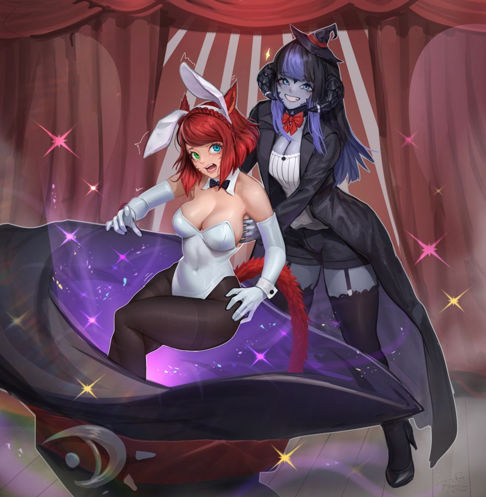 Keeper, a blue au ra in a magician's outfit and a tiny witch hat, pulls Mica in a white bunny suit from a really big witch hat on stage as part of a magic trick. Mica looks a little disoriented & surprised. Keeper looks quite pleased with herself. 