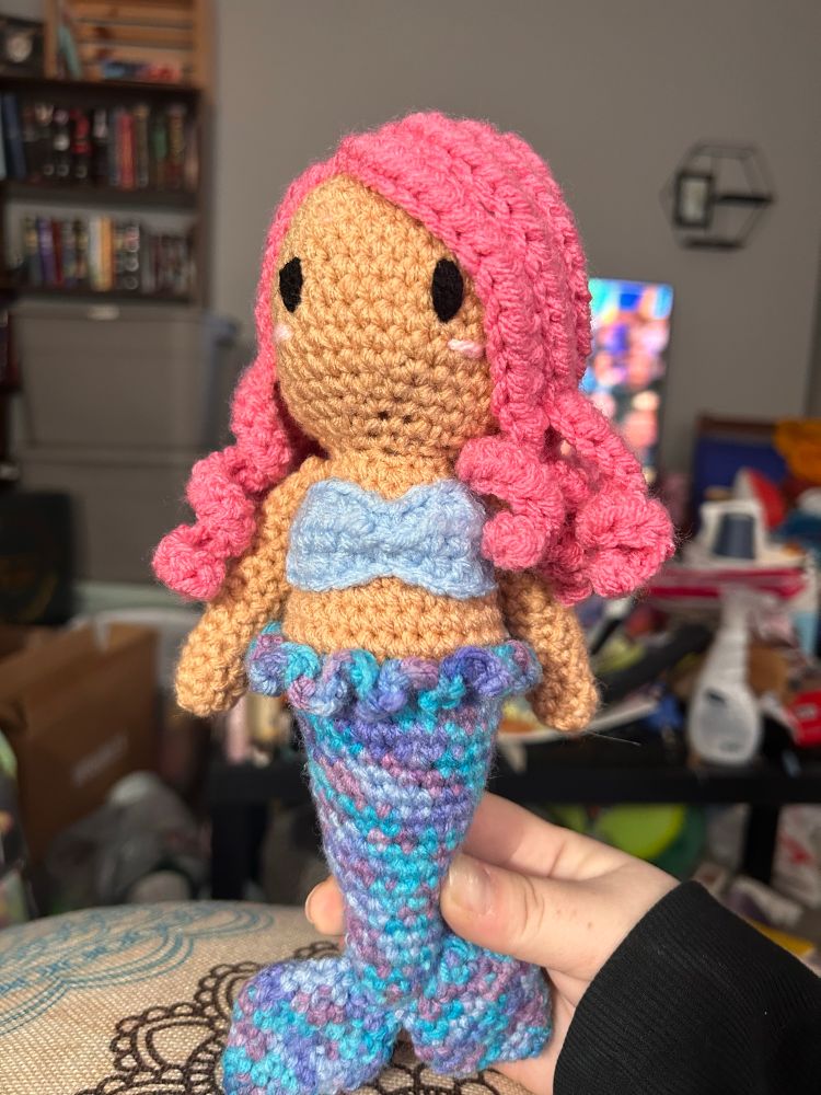 Crocheted mermaid with blueish ombré tail and pink hair