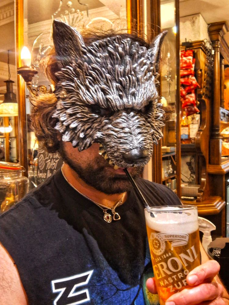 Drinking beer from a straw because I seem to become a wolf... or am wearing a wolf mask.