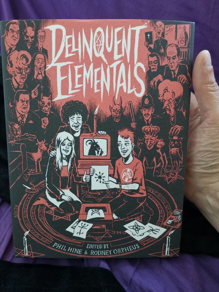 book cover: "Delinquent Elementals" edited by Phil Hine & Rodney Orpheus. Hardback with dustjacket showing two men and a woman sitting in a magical circle with a computer surrounded by a variety of demonic figures, plus political figures from the 1980s.
