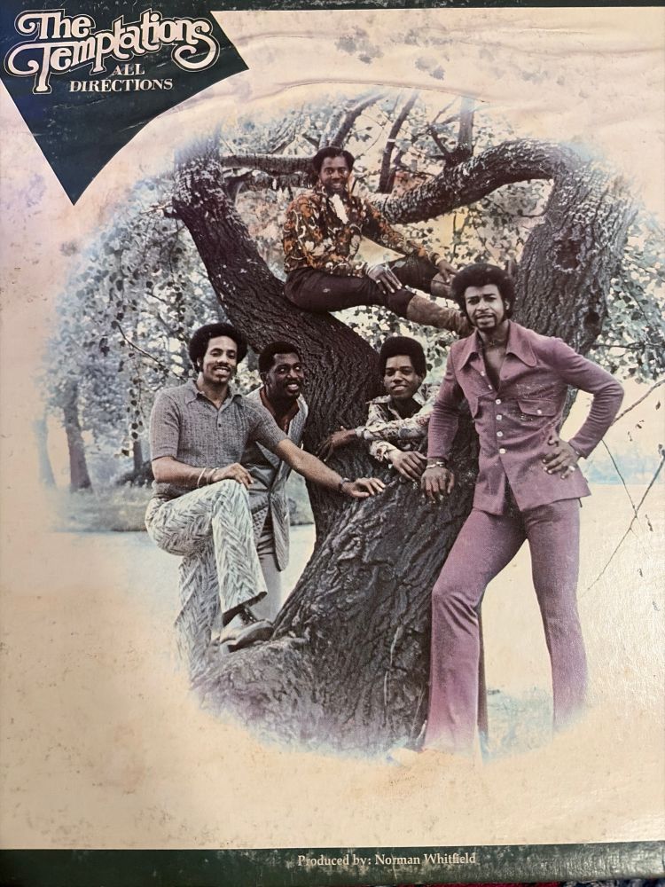 Album cover to the Temptations LP All Directions. Features all five members of the Temptations posing for a photo with a great climbing tree.