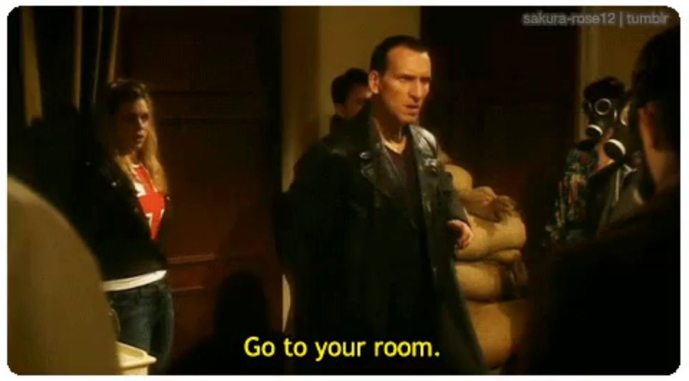 a man in a leather jacket says " go to your room " in front of a group of people