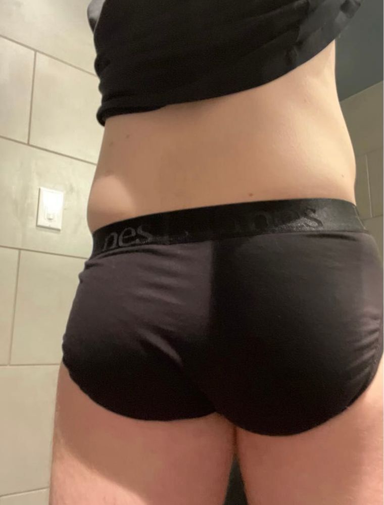 A picture of my fat butt and love handles in silky, black Hanes briefs in a locked, single-person restroom.