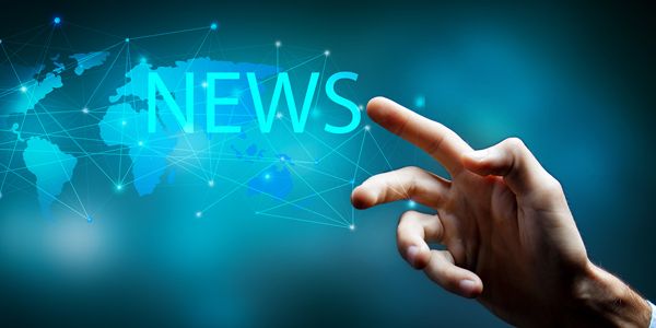 Image of the world map with the text 'NEWS' and a finger pointing at the map