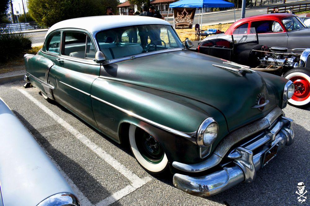 A dark green 1951 Oldsmobile Super 88 2 door parked in the 6th annual Lost Souls Get Down car show at the 22nd St. Landing Seafood Grill & Bar. 