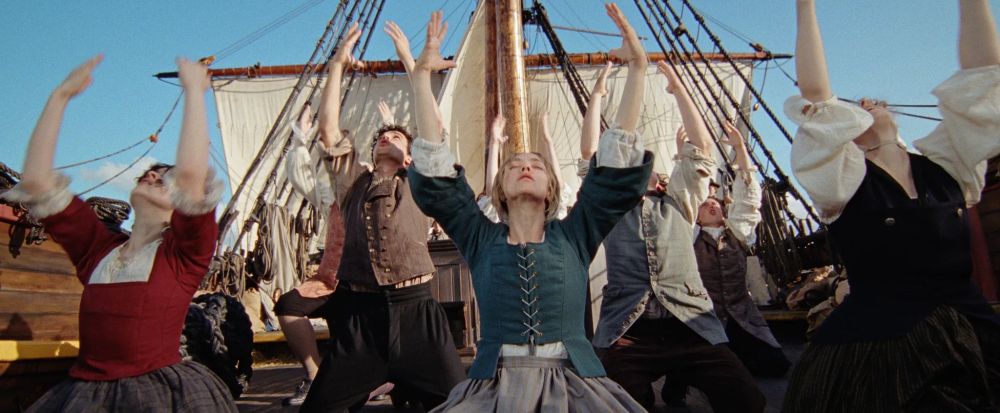 The Testament of Ann Lee cast dancing on a boat