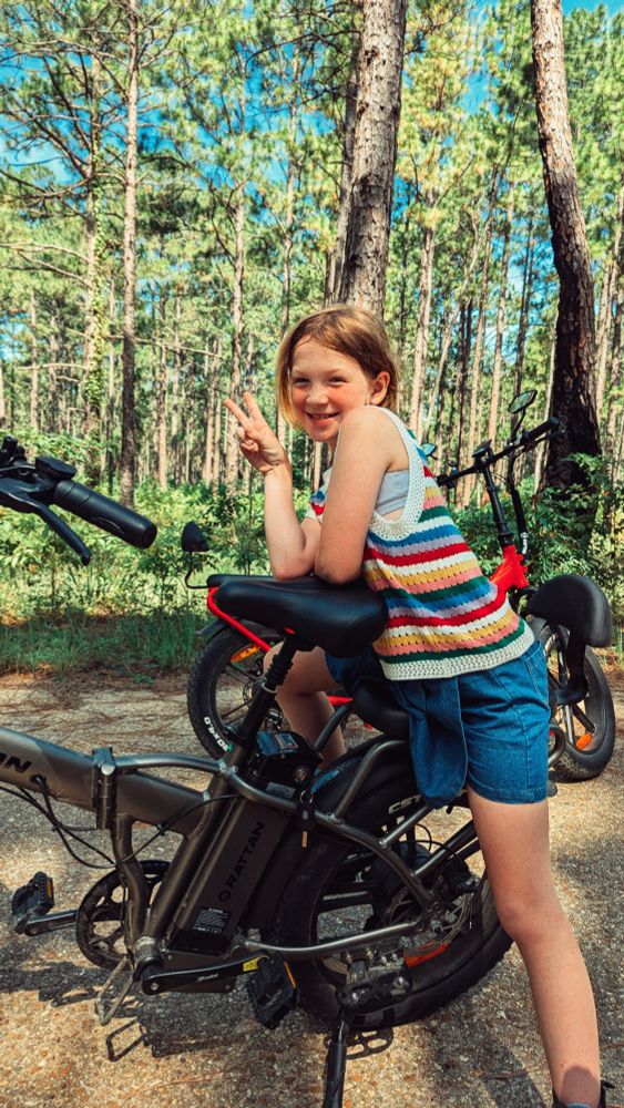 Girl leaning on electric bike