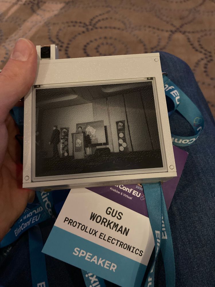 A picture on the eink display of the main conference stage