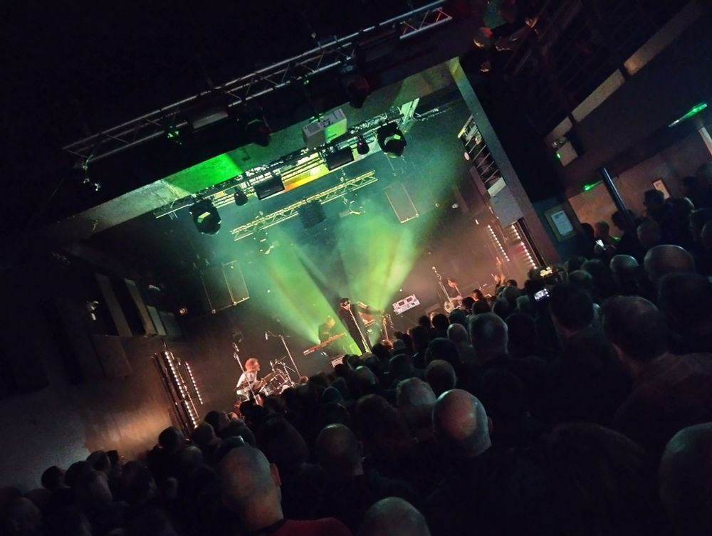 A stage with musicians and lights