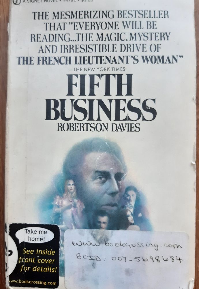 Book cover for Fifth Business, by Robertson Davies. White background except for a patch in the centre showing various characters from the book, in a kind of soft focus. 
