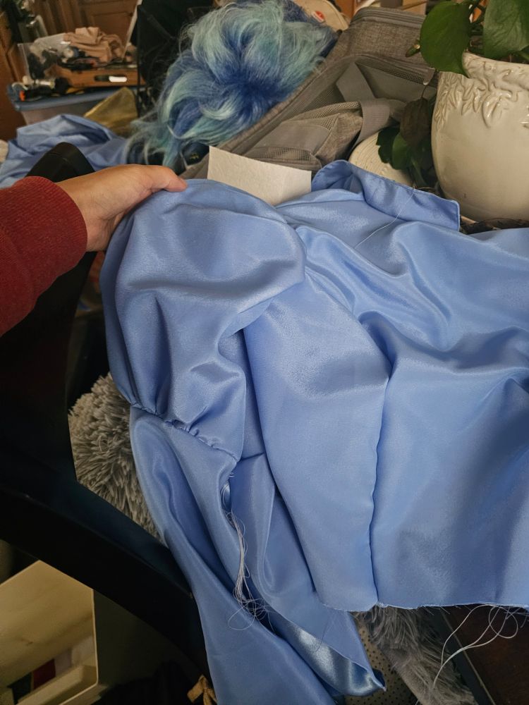 A blue bodice with puffed sleeves