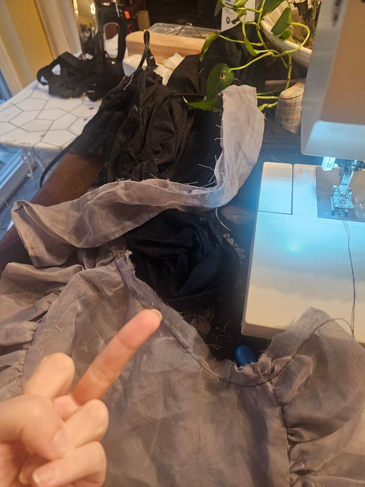 The same apron, this time in pieces and with the sewist flipping it off