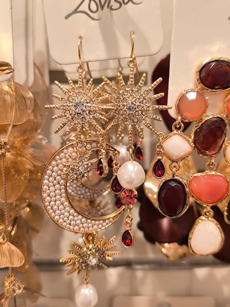 Large gold earrings with pearls and red dropping charms
