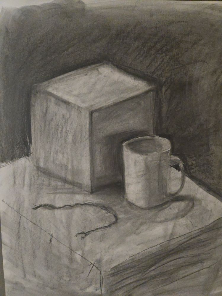 Charcoal drawing of a cube and a mug on the right.  A piece of curved string on the left
