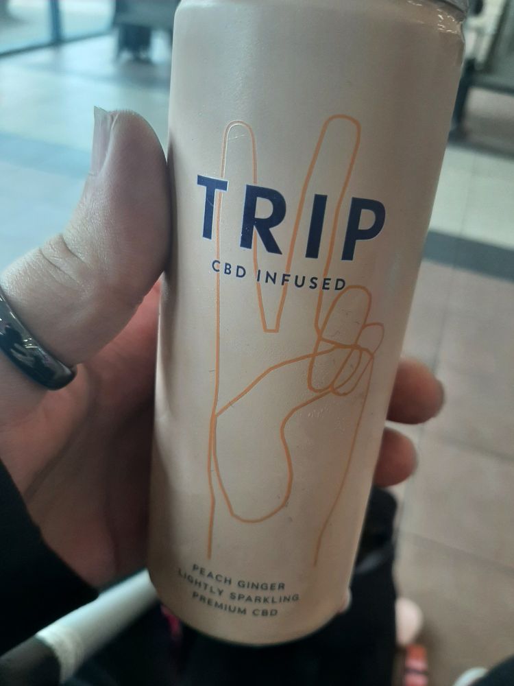 Pic of a small can of trip CBD infused peach ginger soda. 