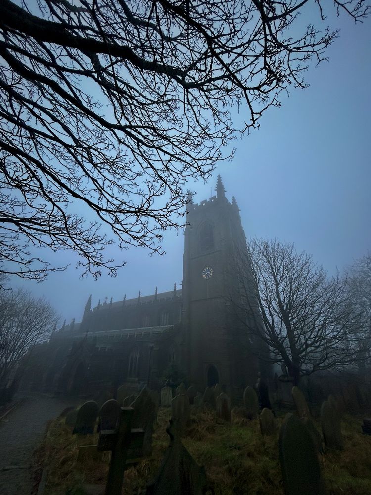 The church of St Thomas the Apostle looms large. Shot using my phone's telephoto function, the church looks like it's leaning back, trying to get away from the bare branches encroaching from the left. In the lower part lies a jumble of gravestones. I wouldn't have been surprised to find the body of David Warner here, impaled by the bell tower's lightning conductor (a scene from 1970s horror movie, The Omen).