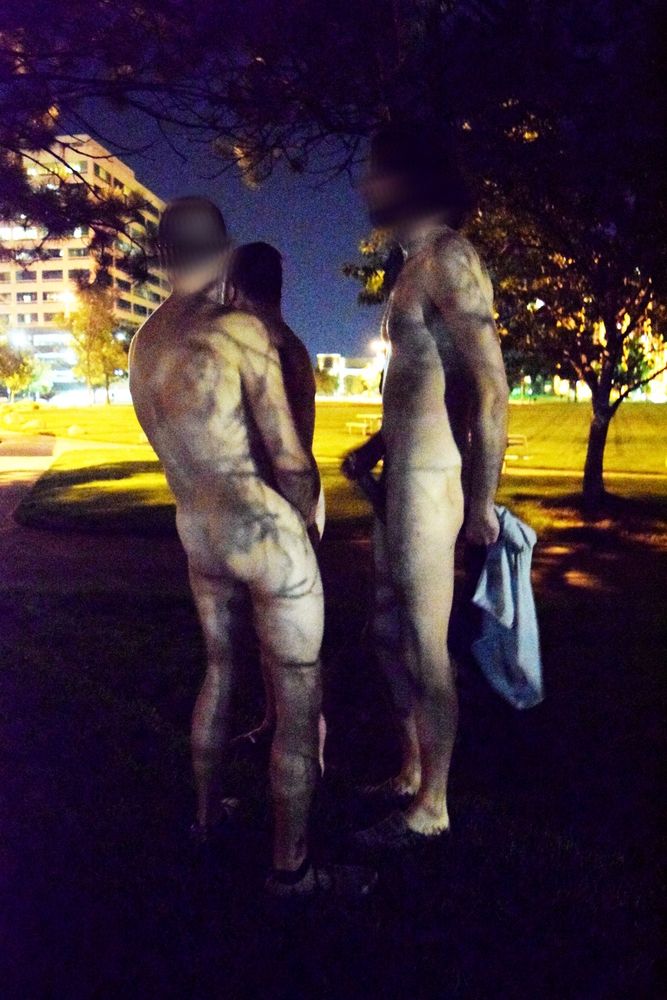 Denver D, Exhibpisser, and Carlos jacking nude in full view of the street. Carlos is holding his shirt behind him, but Denver D and Exhibpisser have nothing to cover up with in reach.