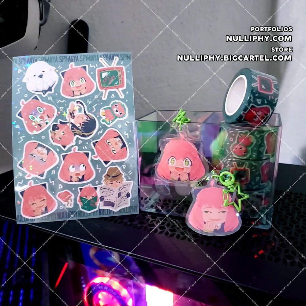 product photo of my Anya merch: sparkle holographic vinyl sticker sheet featuring Anya's funny expressions and all her favorite things, acrylic charms showing Anya's excited and smug expressions on each side, and washi tape with the same designs as the sticker sheet on a funky background.