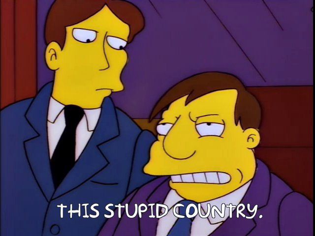 Springfield mayor Joe Quimby grits his teeth and says "This stupid country." A screenshot from S08E18 of The Simpsons, "Homer vs. the Eighteenth Amendment"