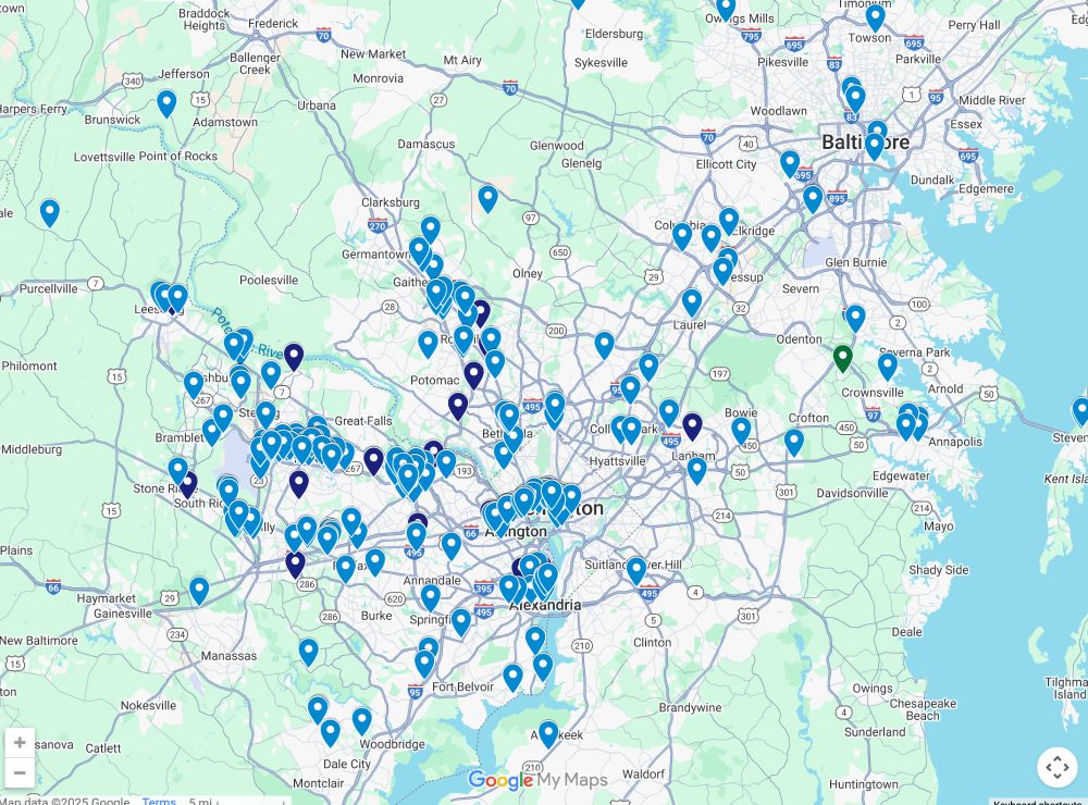 A screenshot of a map of companies with ICE contracts showing the Washington, D.C., Baltimore, and Northern Virginia region. The map is covered with numerous blue and teal location markers, heavily clustered around Washington, D.C., Arlington, and Alexandria, with additional concentrations in Montgomery County, MD, and Baltimore. Markers extend west toward Leesburg, VA, north to Frederick, MD, east toward Annapolis, and south to Woodbridge, VA. The markers appear in varying shades of blue, suggesting different categories of sites. Major highways such as I-495 (Capital Beltway), I-66, I-270, and I-95 are visible along with surrounding towns and suburbs.
