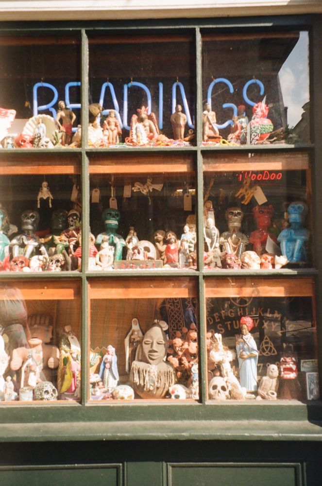 Window display of voodoo figurines 