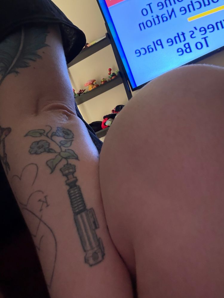 A photo of my Star Wars tattoo. It is Luke Skywalker’s Lightsaber handle with flowers coming out of it.