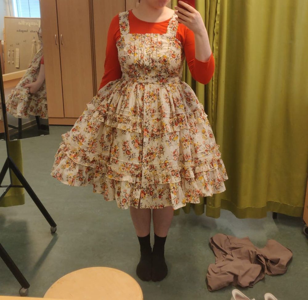 Dressing room photo of the poster, wearing a floral lolita dress. 