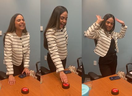 After defending her Ph.D. thesis Valerie hits the "EASY" button, which says, "that was easy". She celebrates. 