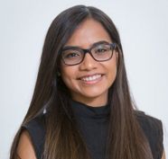 An extremely talented female scientist smiles.