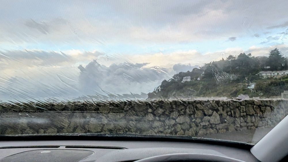 Rain soaked view through the windscreen 