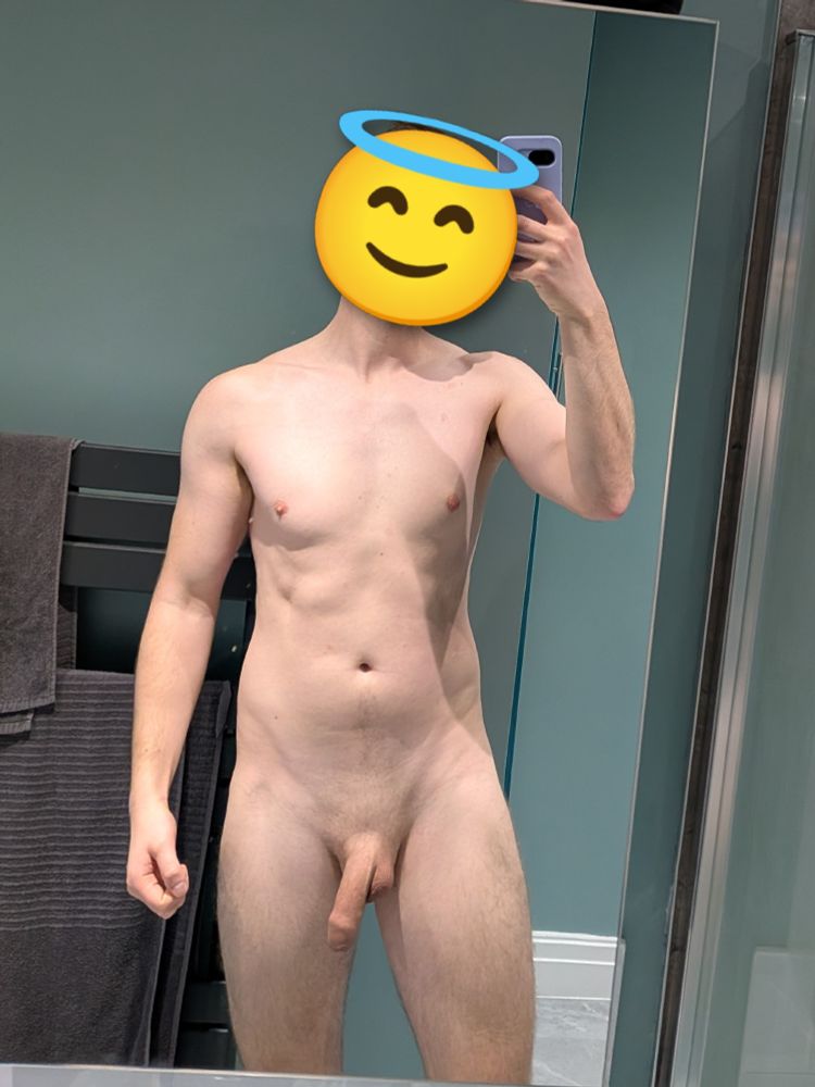 Naked man revealing a soft cock. Face is obscured by an angel emoji.