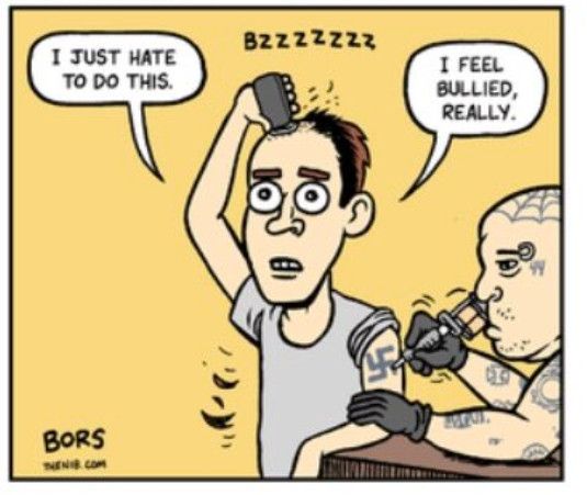 Neo-Nazi buzzing his own hair off while he receives a swastika tattoo.
"I just hate to do this," he insists.  "I feel bullied, really."
