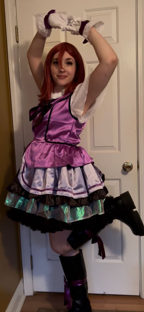 Eden as Maki Nishikino Kira Kira Sensation outfit from Love Live posing full body one leg up and doing heart hands above head