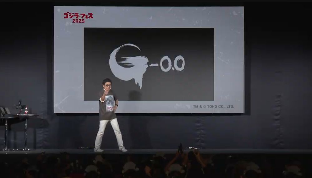 director. standing in front of G-0.0 logo