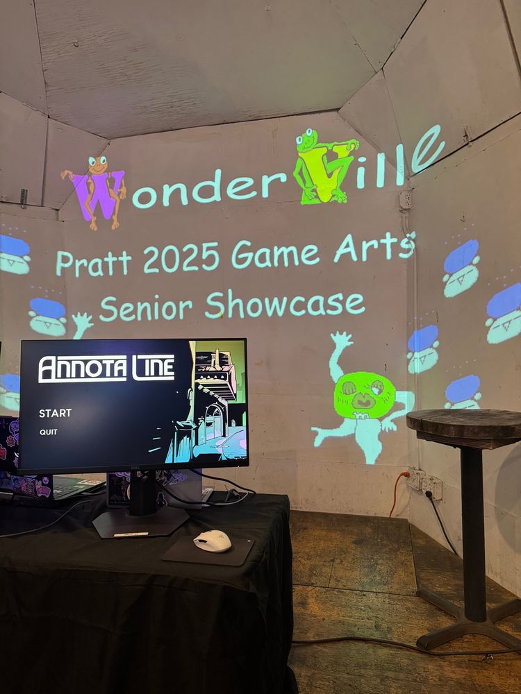 picture of the wonderville stage displaying annota line, with pratt 2025 game arts senior showcase projected on the wall