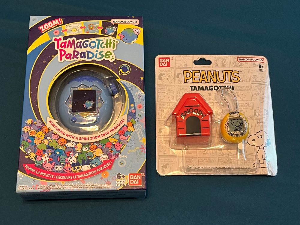 A photo of a Tamagotchi Paradise and Peanuts Tamagotchi Nano, both still in box