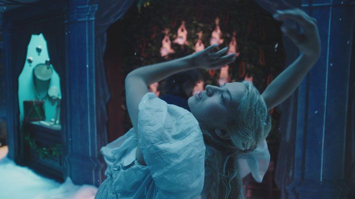 A dancer poses in the snow in a 2020 adaptation of A Christmas Carol. 