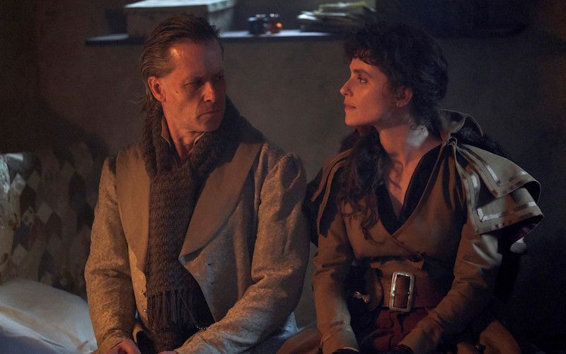 Scrooge converses with The Ghost of Christmas Present.