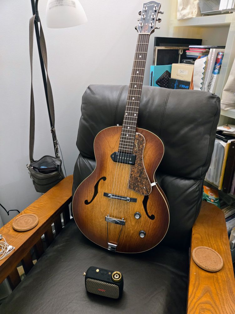 Godin 5th Avenuen jazz guitar on a chair with little Spark GO amp. 