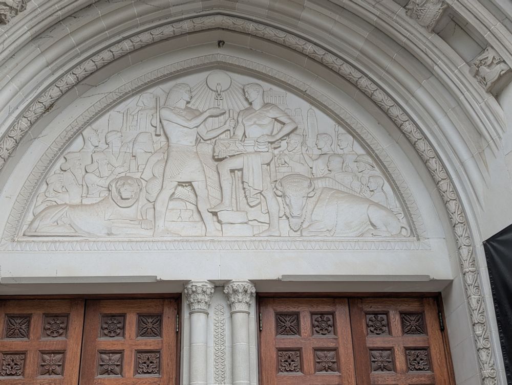 Ulric Ellherhausen's 1931 typanum over the Institute for the Study of Ancient Cultures at the University of Chicago showing Eastern Phoenicians, Persians, and Egyptians passing writing to the west